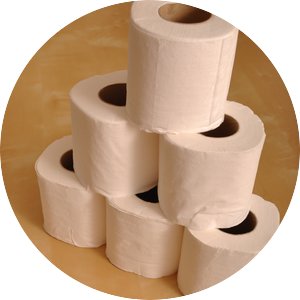 A stack of toilet paper rolls on linoleum floor.